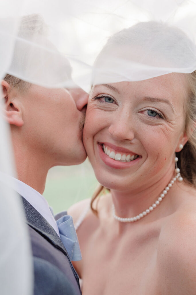 Silhouette of bride and groom against a glowing desert sky during golden hour wedding photos.