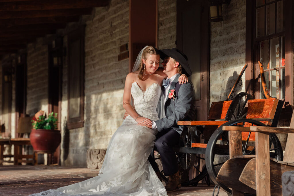“Editorial style wedding portraits of couple at Arizona ranch venue with saguaro cacti and open sky.”