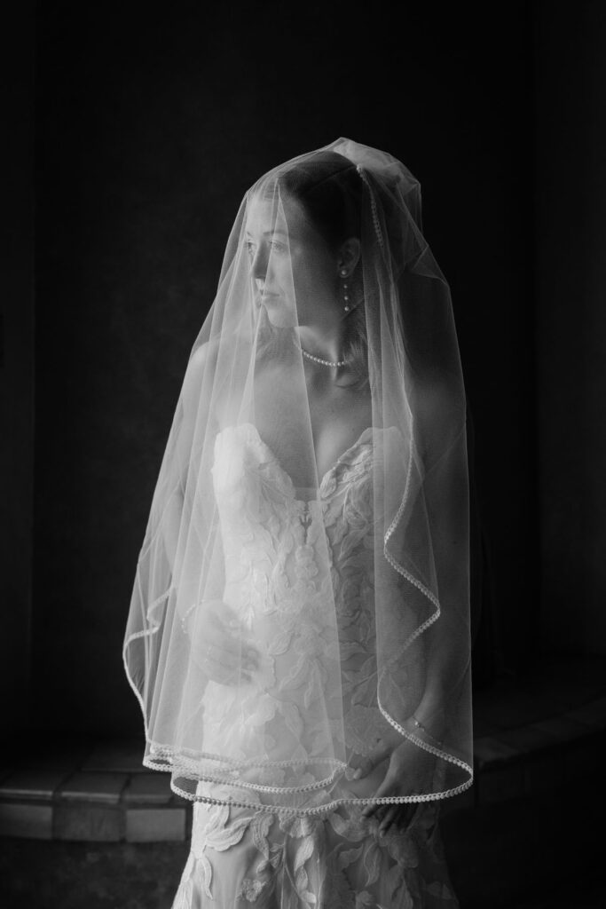 “Bride getting ready in adobe style room at Tanque Verde Ranch with soft natural window light.”