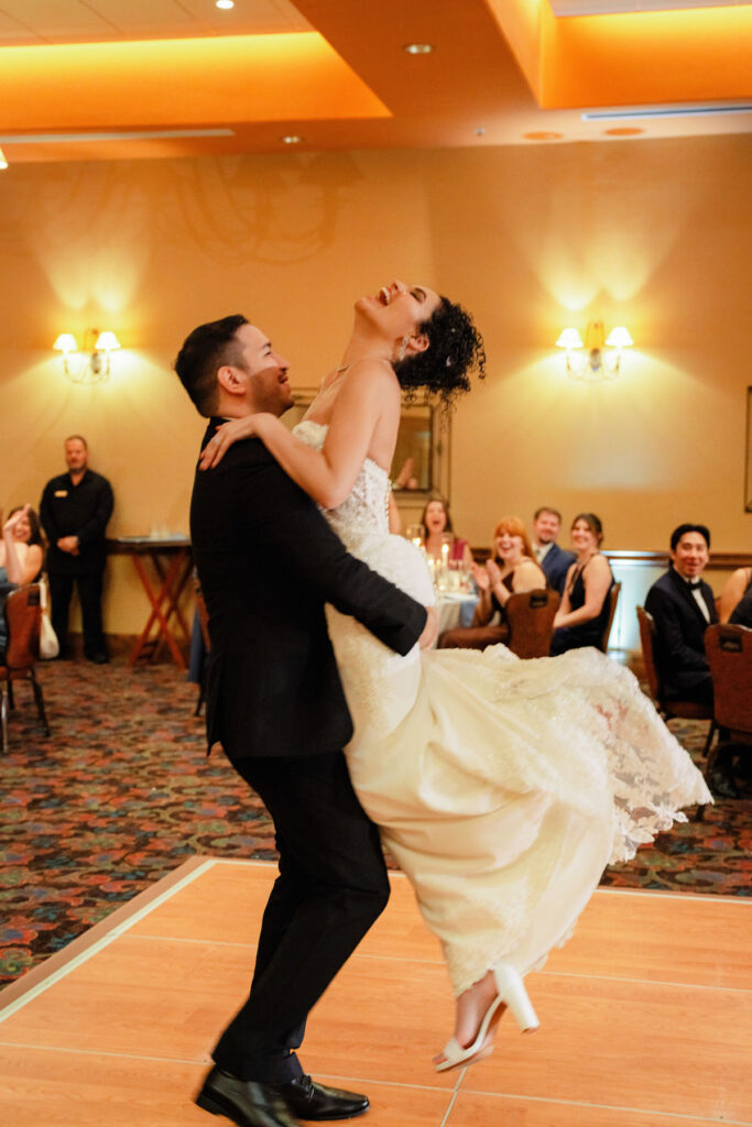 Romantic first dance of bride and groom surrounded by friends and family at Hacienda Del Sol.