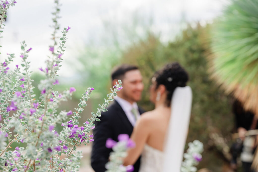 Bride and groom sharing their first look in a tiled courtyard at Hacienda Del Sol in Tucson.