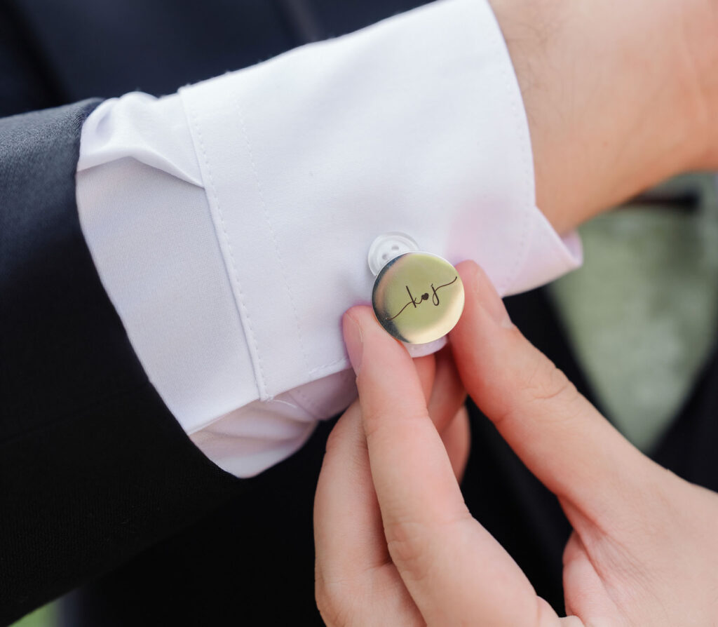 Groom adjusting his cufflinks before the ceremony at a Tucson resort wedding.