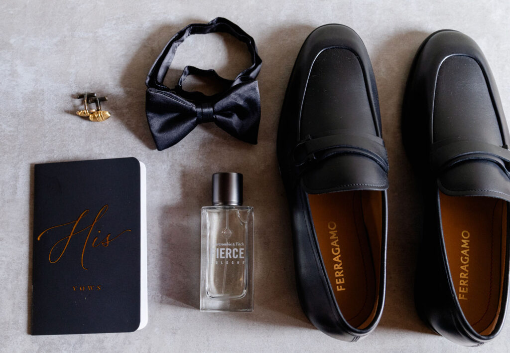 Beautiful flat lay detail shot of the grooms deatils.