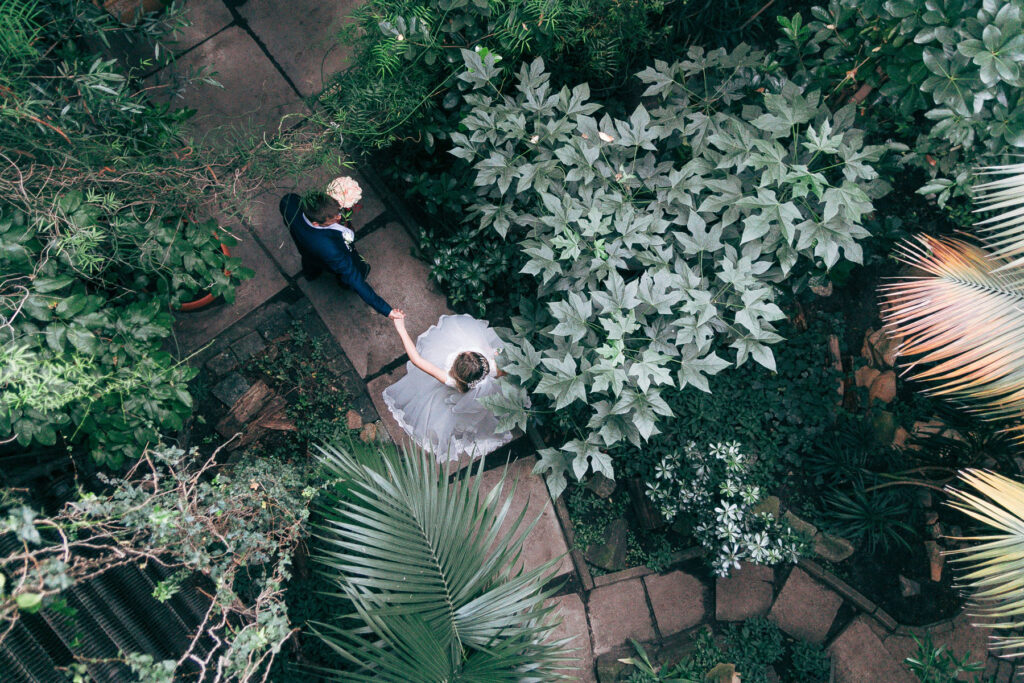 beautiful photo of the bride and groom walking, taken with a drone from above.